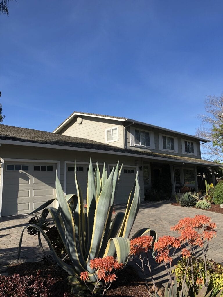 Two-story house with agave and succulents